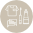 An icon showing a t-shirt, a bar of soap, a toothbrush, and a toothpaste tube, all outlined in white on a beige circular background.